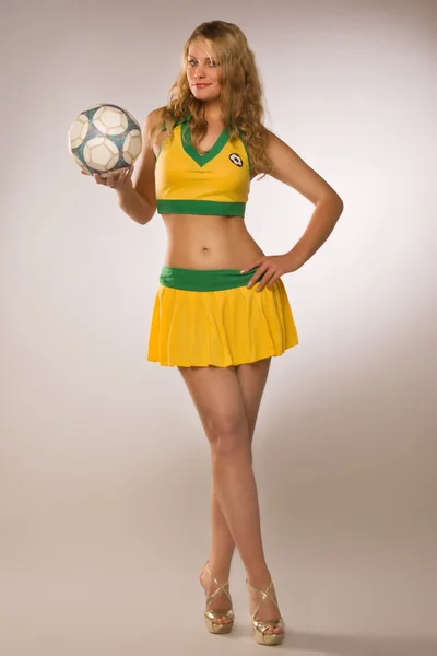 Beautiful sexy blond cheerleader whit soccer ball — Stock Photo, Image