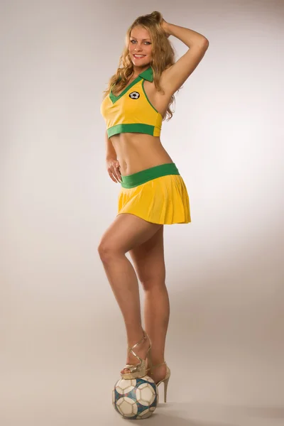 Beautiful sexy blond cheerleader whit soccer ball — Stock Photo, Image