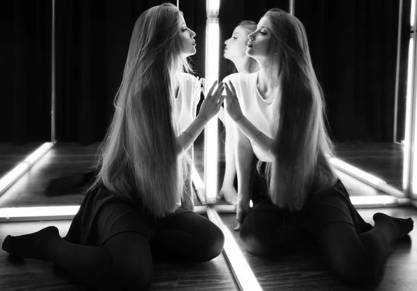 Sexy girl and her reflection in mirror table — Stock Photo, Image