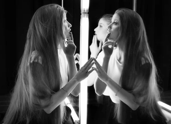 Sexy girl and her reflection in mirror table — Stock Photo, Image