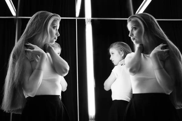 Sexy girl and her reflection in mirror table — Stock Photo, Image