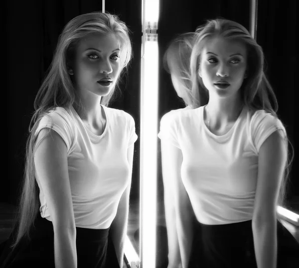 Sexy girl and her reflection in mirror table — Stock Photo, Image