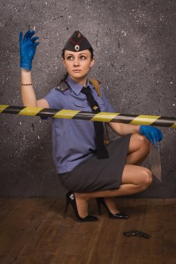 Policewoman criminalist on a crime scene clipart