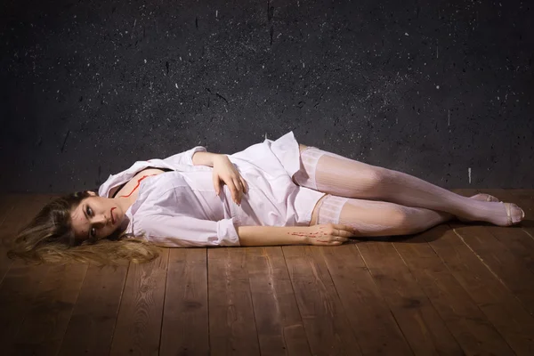 Dead nurse lying on the floor — Stock Photo, Image