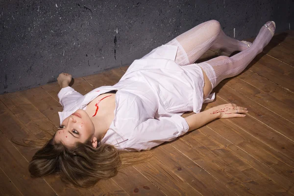 Dead nurse lying on the floor — Stock Photo, Image