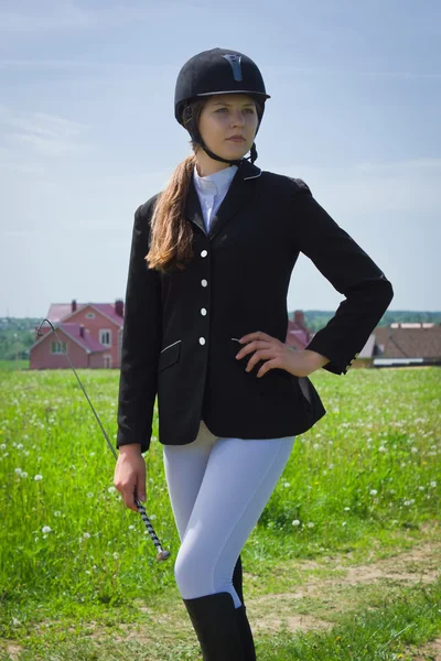 Mooi meisje jockey dressing uniform — Stockfoto