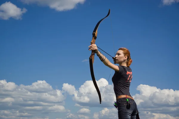 Archery woman bends bow archer target narrow — Stock Photo, Image