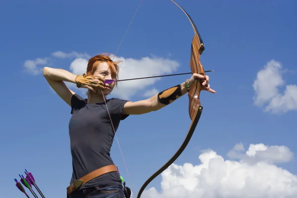 Archery woman bends bow archer target narrow — Stock Photo, Image