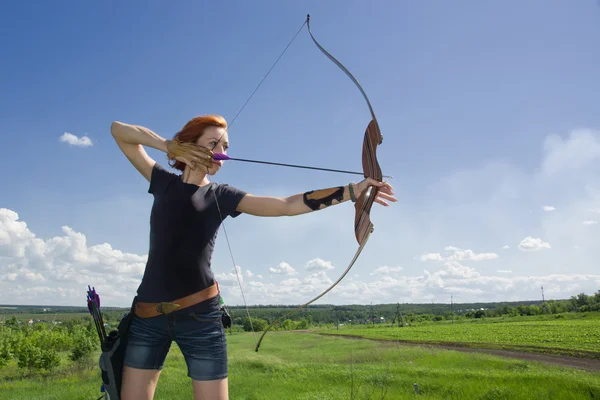 Archery woman bends bow archer target narrow — Stock Photo, Image