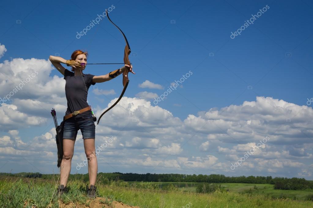 Archery woman bends bow archer target narrow — Stock Photo © Demian
