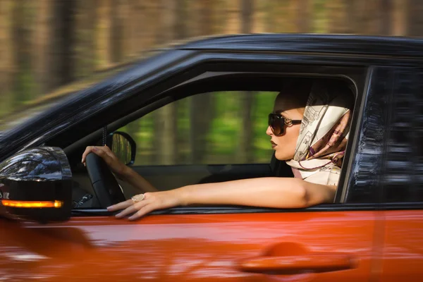 Fashion  woman behind steering wheel — Stock Photo, Image