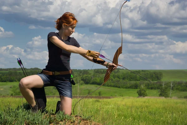 Archery woman bends bow archer target narrow — Stock Photo, Image