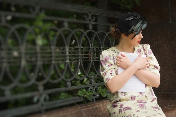 Very beautiful soviet girl in retro style with a music book — Stock Photo, Image