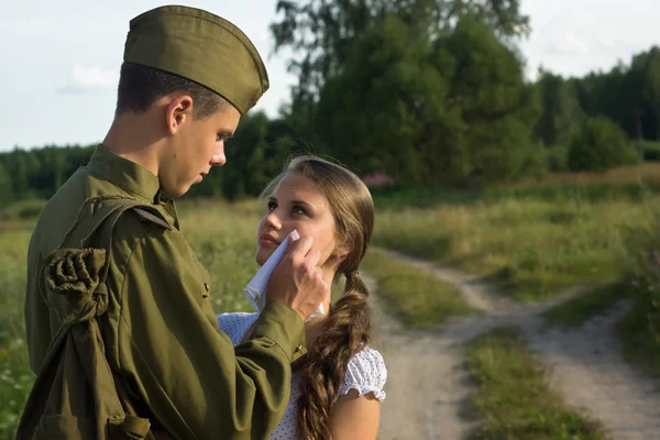 Soviet soldier saying goodbye to girl — Stock Photo, Image