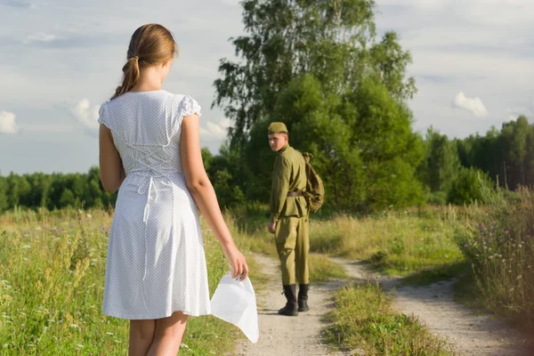 Soviet soldier saying goodbye to girl — Stock Photo, Image