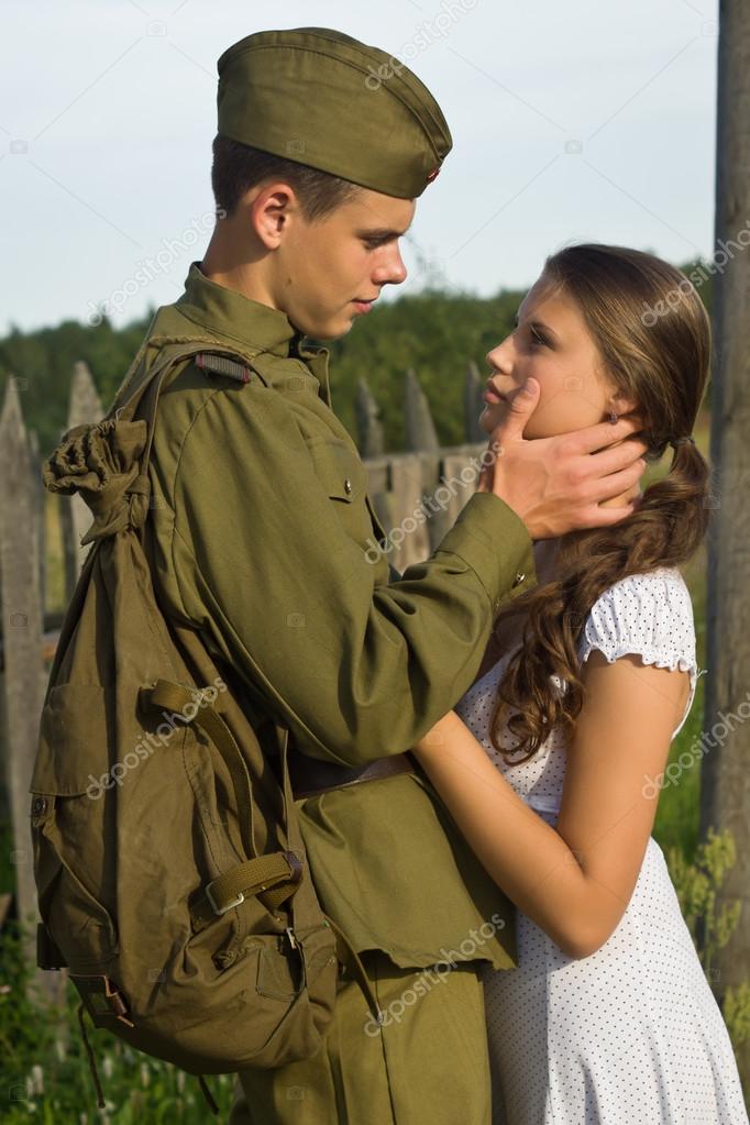 Soviet soldier saying goodbye to girl