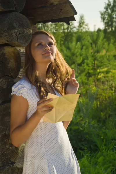 Young russian girl read a letter. — Stock Photo, Image