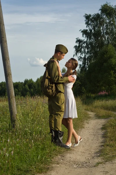Soviet soldier saying goodbye to girl — Stock Photo, Image