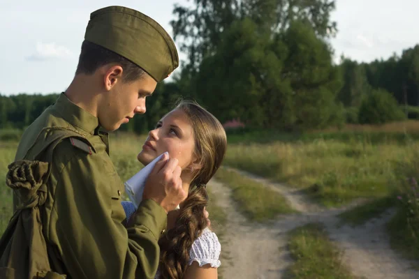 Soviet soldier saying goodbye to girl — Stock Photo, Image