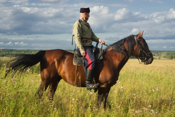 Russian Cossack inspecting the border on horseback — Stock Photo, Image