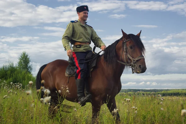 Russian Cossack inspecting the border on horseback — Stock Photo, Image