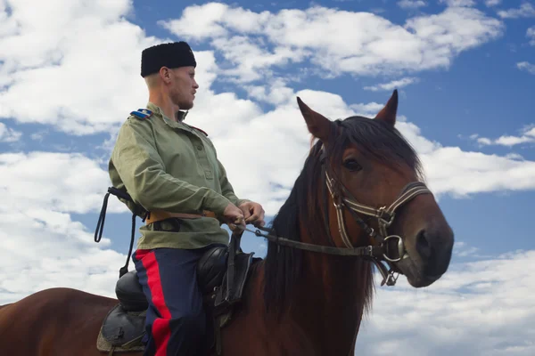 Russian Cossack inspecting the border on horseback — Stock Photo, Image