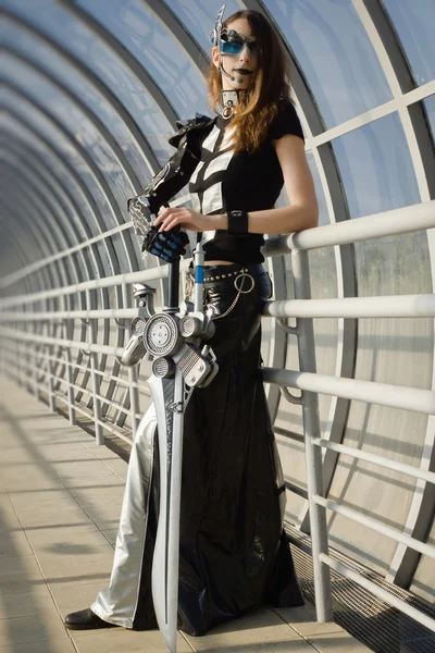 Futuristic girl holding a blade — Stock Photo, Image