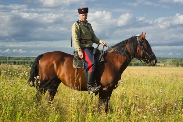 Russian Cossack inspecting the border on horseback — Stock Photo, Image