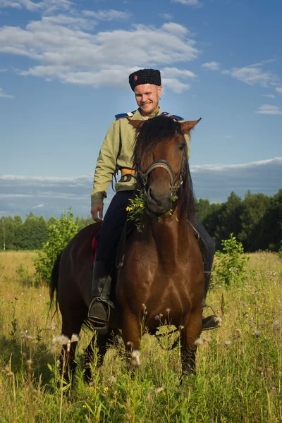 Russian Cossack inspecting the border on horseback — Stock Photo, Image