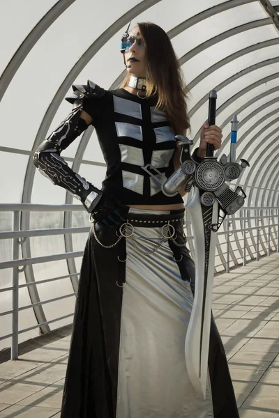 Futuristic girl holding a blade — Stock Photo, Image