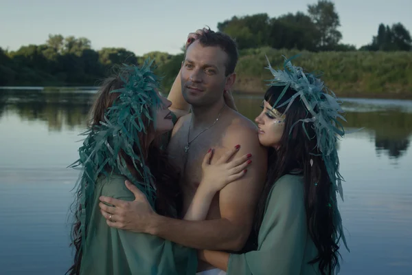 Love between men and two beautiful mermaids — Stock Photo, Image