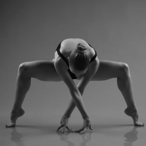 Modern ballet dancer posing on dark background — Stock Photo, Image