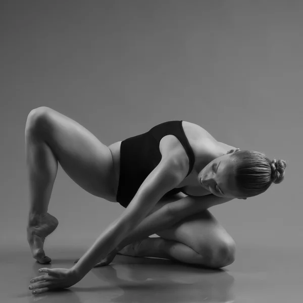 Modern ballet dancer posing on dark background — Stock Photo, Image