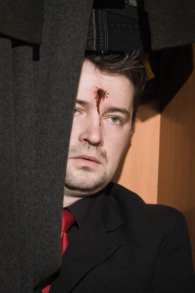 Business man shot in the head in the closet — Stock Photo, Image