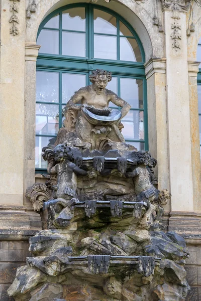 Closeup half naked faunus statues fountain at Zwinger palace in — Stock Photo, Image