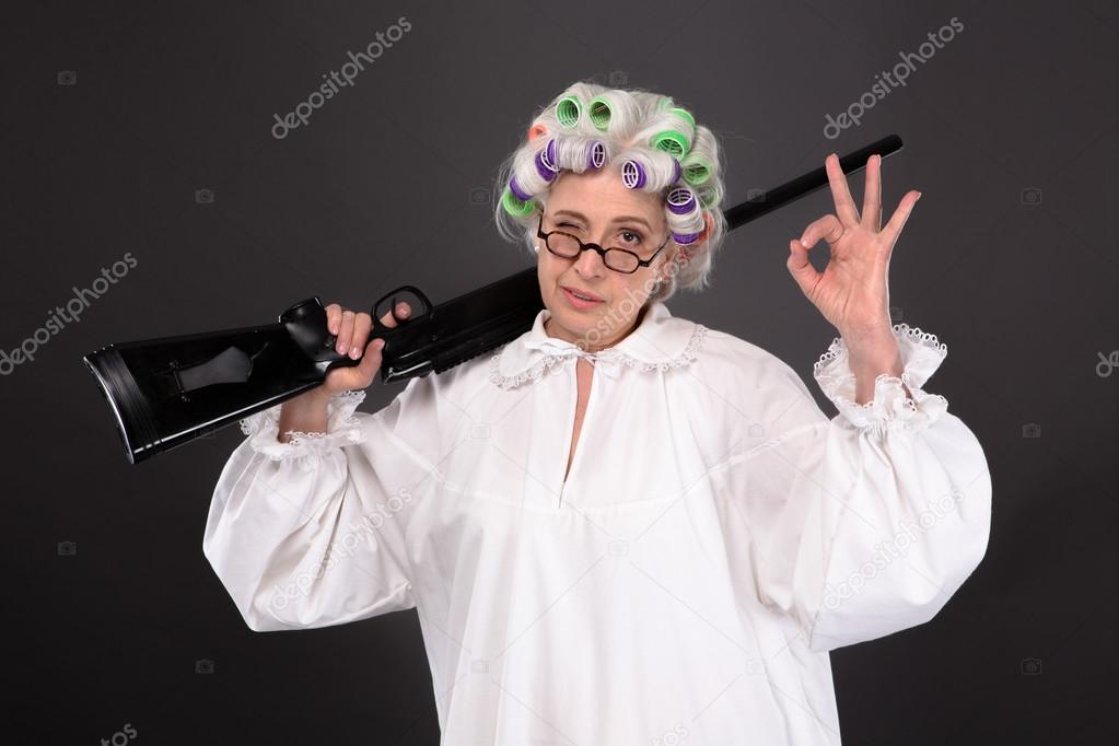 Grandma Holding Gun Stock Photo