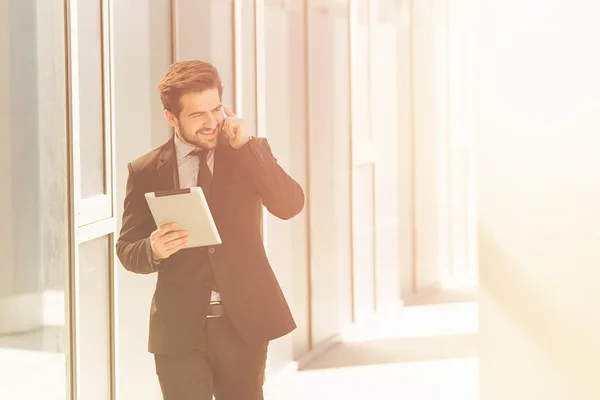Businessman speaking over phone — Stock Photo, Image