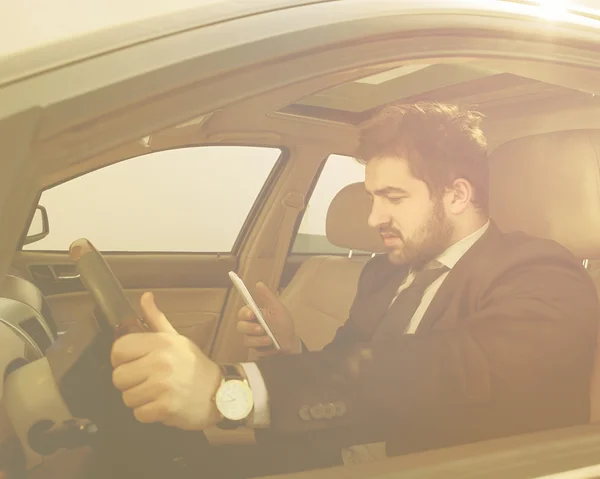 Businessman driving car — Stock Photo, Image