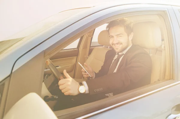 Businessman driving car — Stock Photo, Image