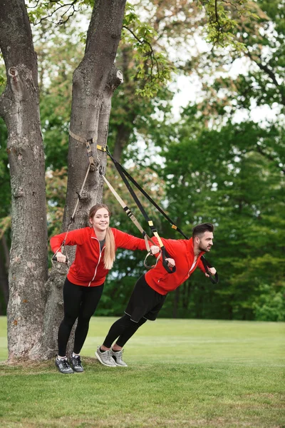 Sport man and woman training in park — Stock Photo, Image