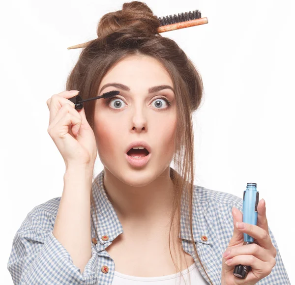 Woman with hairstyle doing makeup — Stok fotoğraf