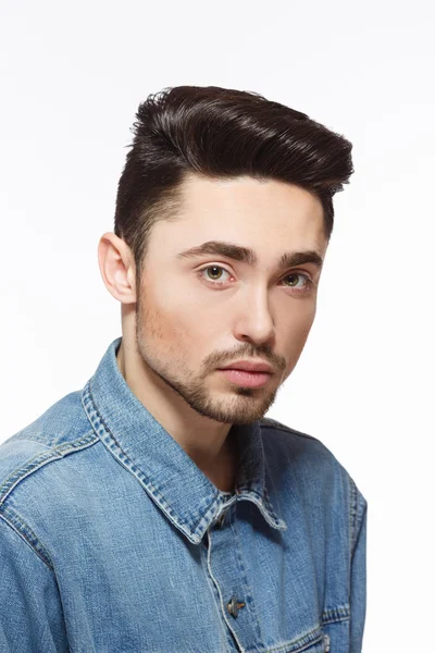 Man with modern hairstyle in studio — Stock Photo, Image