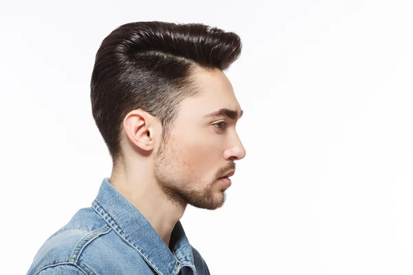 Man with modern hairstyle in studio — Stock Photo, Image