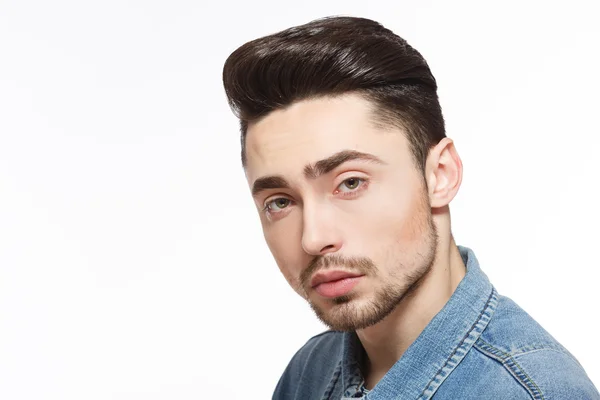 Man with modern hairstyle in studio — Stock Photo, Image