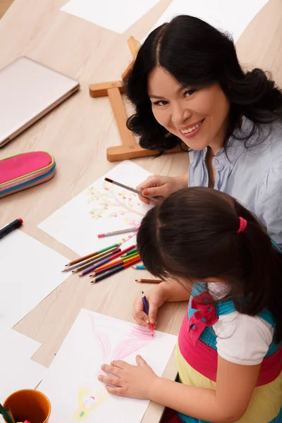 Mother and daughter drawing Stock Image