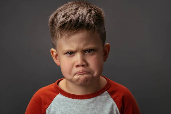 Preschool boy expresses sad emotions. Conflict concept. Close up portrait — Stock Photo, Image