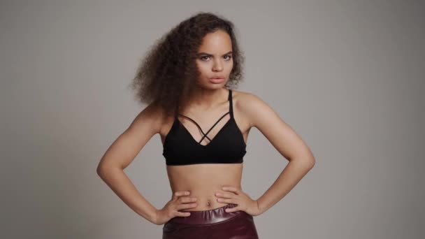 Denying, shields, stop and rejecting gesture African American young woman standing in black bare shoulder top isolated on grey background. Human emotions, facial expression concept — Stock Video