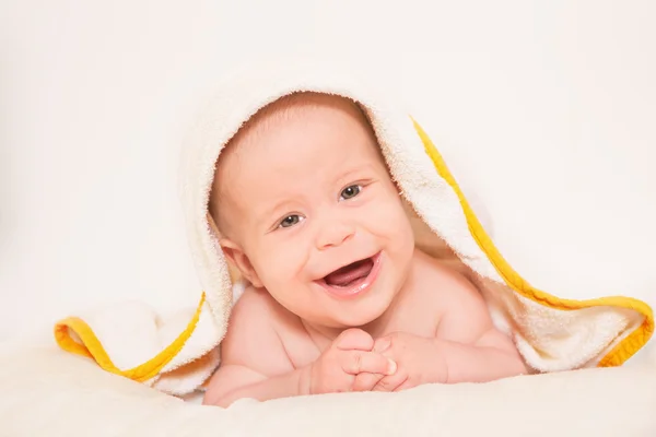 Newborn smiling on towel — Stock Photo, Image