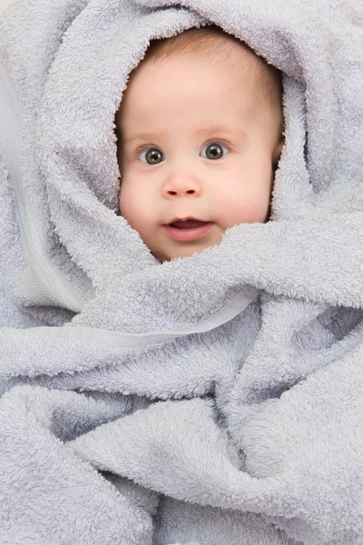 Infant in blue towel — Stock Photo, Image