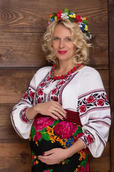 Ukrainian pregnant woman in vyshyvanka Stock Photo